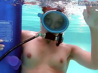 Minnie Manga blows dildo underwater 