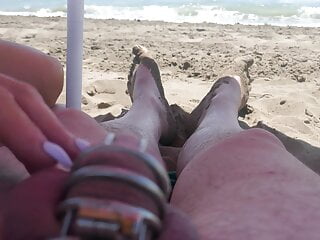 teasing in chastity on the beach