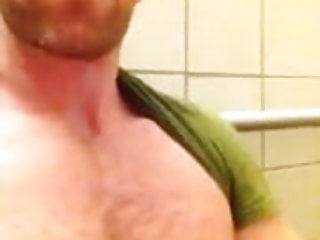 GUY STROKES AND CUMS IN PUBLIC RESTROOM.