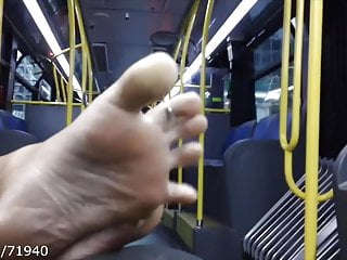 Candid feet and soles on the bus