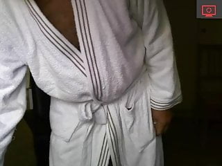 in a bathrobe and without