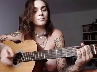 Busty plays wicked game on guitar...