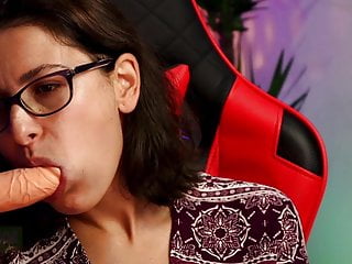 Woman With Glasses Sucking Dildo Sensually