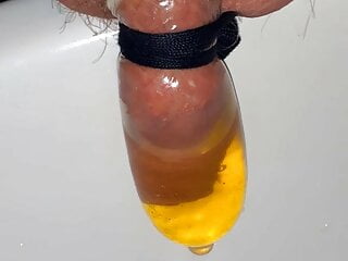 filling a condom with piss