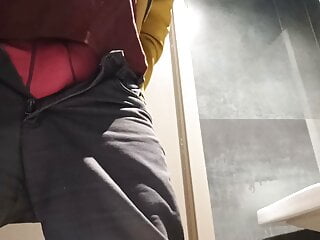 Pissing in a public toilet, uncutted cock.