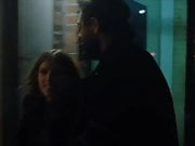 Anna Kendrick making out in front of a building 