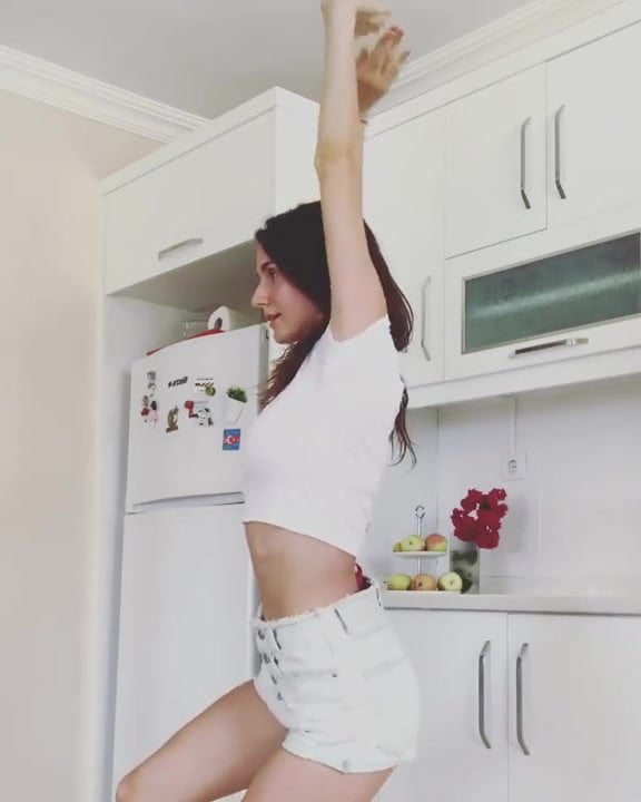 Non nude pretty girl dances in her kitchen