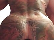 Tatted man enjoying a big dildo