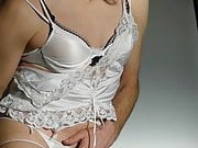 Crossdresser in silky white lingerie (Thlin1040260)