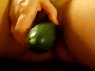 Wife fucks herself with cucumber.