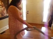 housewife showing off when cleaning