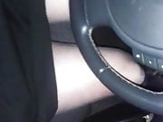 Driving with black shiny pantyhose and pleated skirt