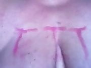 Slave with writing on tits and cunt 