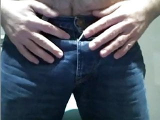 Hairy cub teasing his blue jeans...