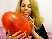 Margo popping baloons with long sharp nails
