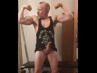 Verbal Muscular Bodybuilder Daddy Flexing Muscles With Huge Boner In His Gym Vest Shoots A Huge Load Of Cum