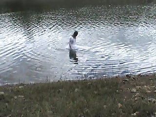 Big wedding gown, wading into a favorite lake.