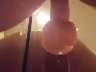 Dildo fucking against the mirror