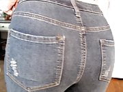 Cute curly haired blonde farting in jeans