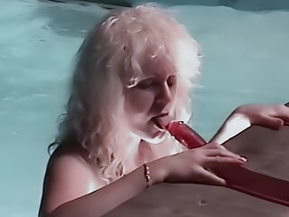 Wet hooker by the pool with a double dildo