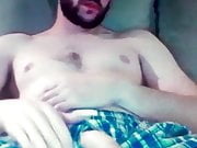 Bearded guy shows his huge hung flaccid cock in shorts 