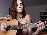 Busty emo girl plays Wicked Game on guitar