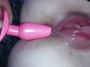 Girlfriend with pumped pussy having butt plug inserted