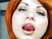 Woman licking her lips moist tongue and looks