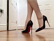 Black high heels, nude feet