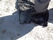 crushing wet soil on black skirt & washing